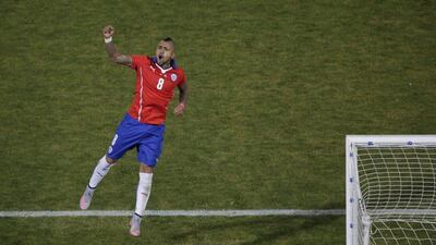 Chile's Arturo Vidal celebrates after scoring his penalty to make it 2-1 in the shootout at the end of the Copa America final on Saturday. Ricardo Moraes / Reuters