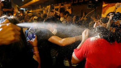 Police use pepper spray on protesters in Hong Kong on November 6, 2016, a day before China’s parliament was expected to announce its interpretation of the territory’s Basic Law to resolve a controversy over the swearing in of two legislators. Tyrone Siu / Reuters