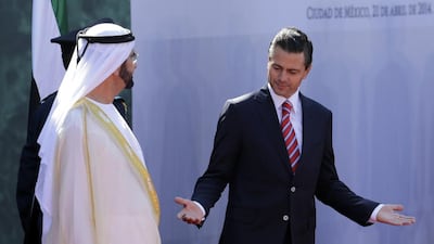 Sheikh Mohammed inspects the guard of honour with Mexican President, Enrique Peña Nieto. Henry Romero / Reuters