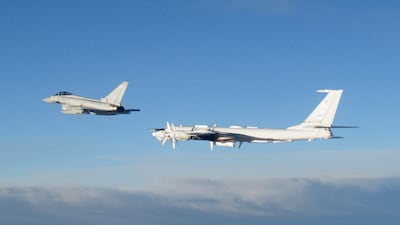 An RAF Typhoon monitoring a Russian Tupolev Tu-142 aircraft. PA
