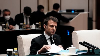 Mr Macron during a meeting at the Great Hall of the People. Reuters
