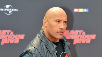 Dwayne Johnson, in simple jeans and a tee, arrives for the premiere of 'Fast Five' at Cinedom in Cologne, Germany, on April 27, 2011. EPA