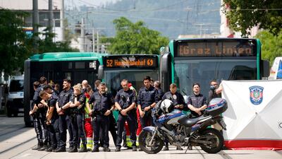 Police officers at the scene as children are evacuated from the school. Reuters