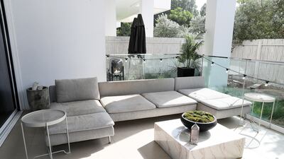 The outdoor seating area of Ryan Almond’s apartment