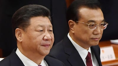 Chinese President Xi Jinping (L) and Premier Li Keqiang arrive for the opening session of the National People's Congress in Beijing.Greg Baker / AFP
