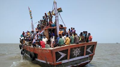 Indian fishermen, who said they were refused entry at two ports after a nationwide lockdown, travel in the Arabian Sea attempting to reach their home state Maharashtra in India. Reuters