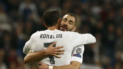 Cristiano Ronaldo congratulates Real Madrid teammate Karim Benzema after the team’s eighth goal, Benzema’s third, on Tuesday night. Juan Medina / Reuters