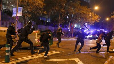 Protesters and Catalan regional police clash in the surroundings of Camp Nou stadium. EPA