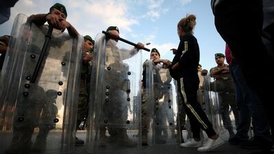 Lebanese army soldiers stand guard during ongoing anti-government protests in the port city of Sidon, Lebanon. Reuters