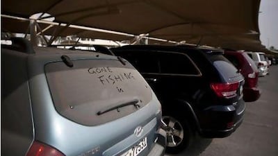 Several cars sit covered in dust, seemingly abandoned at the Abu Dhabi Airport short-term parking lot as seen on Wednesday afternoon, August 1, 2012. Silvia Razgova / The National