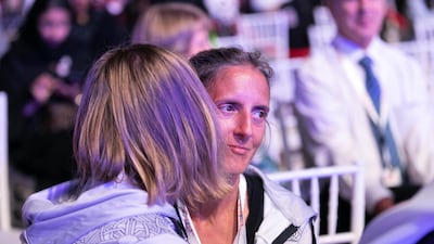 A mother embraces her son at the Special Olympics host town closing ceremony in Global Village. Reem Mohammed / The National