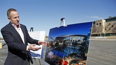 An official of Hollywood Park lists out an impression of a proposed NFL stadium, for which St Louis Rams' owner has shown interest. Nick Ut / AP Photo