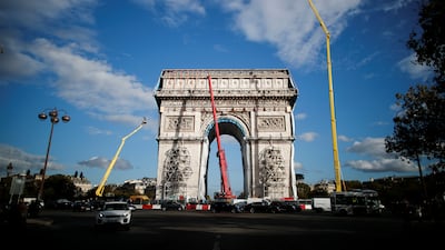 Cranes surround the Arc de Triomphe, as the building is revealed once more, after the art installation. Reuters