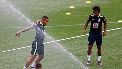 Brazil’s player Gabriel Jesus, left, and his teammate Willian attend the training session. Ricardo Moraes / Reuters
