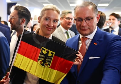 The Alternative for Germany party co-chairman Tino Chrupalla and AfD deputy chairwoman Alice Weidel celebrate. EPA