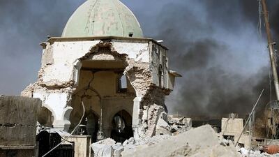 Smoke billows from the ruined Grand al-Nuri Mosque after it was retaken by the Iraqi forces at the Old City in Mosul, Iraq June 29, 2017. Erik De Castro / Reuters