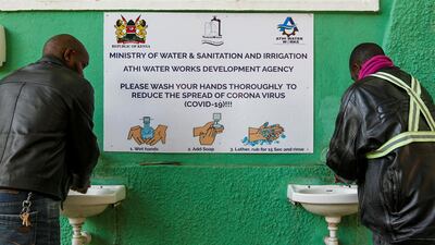 Traders wash their hands with soap and water outside a retail market, amid concerns about the spread of coronavirus disease, in Nairobi, Kenya. Njeri Mwangi / Reuters