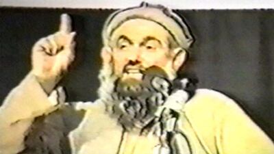 Abdullah Azzam, one of Osama bin Laden’s lieutenants, speaks in this undated still frame from a recruitment video for bin Laden’s extremist al-Qaida network. Al Rai Al Aam / Getty Images