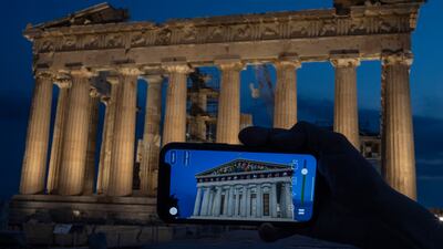 Chronos uses augmented reality to produce digital overlays to show how the Acropolis looked centuries ago. AP