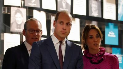The pink dress has a ruffled collar with black polka dots and a velvet waist. Reuters