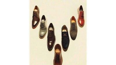 Zahida Kazmi, Pakistan’s first and only known female taxi driver, cleans the windshield of her yellow cab in Rawalpindi. Ms Kazmi became a cab driver to support her six children after her husband died.