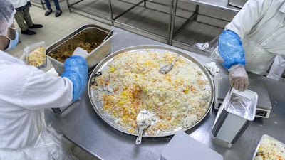 The Dar Al Ber charity prepares iftar meals at Modern Bakery in Al Quoz, Dubai. Antonie Robertson / The National