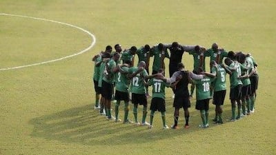 Zambia's national team players gather in a circle at the start of a training session in the village of Machinda, east of Bata, Equatorial Guinea, Monday, Feb. 6, 2012. Zambia will face Ghana Wednesday in their African Cup of Nations semifinal soccer match in Bata.(AP Photo/Rebecca Blackwell) *** Local Caption *** Equatorial Guinea African Cup Soccer.JPEG-00eaf.jpg