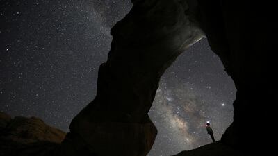 A man watches the stars seen in the skies above Wadi Rum, south of Amman, in Jordan. Reuters