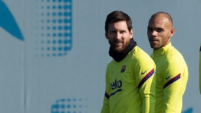 Barcelona's Martin Braithwaite and Lionel Messi during training on the eve of their match against Eibar. EPA