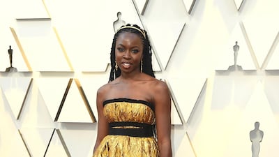 Danai Gurira in a bold, gold Brock Collection dress. Photo: AP