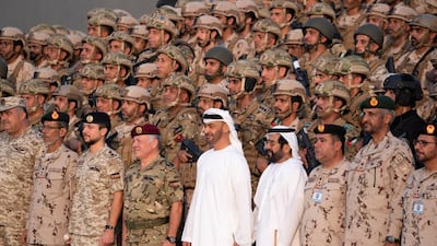 Lt General Hamad Thani Al Romaithi, Chief of Staff UAE Armed Forces (front row 2nd L), Hussein bin Abdullah, Crown Prince of Jordan (front row 3rd L), King Abdullah II, King of Jordan (front row 4th L), Sheikh Mohamed bin Zayed, Crown Prince of Abu Dhabi and Deputy Supreme Commander of the UAE Armed Forces (front row 5th L), Sheikh Tahnoon bin Mohamed, Ruler's Representative in Al Ain Region (front row 6th L) and Brigadier General Saleh Mohamed Saleh Al Ameri, Commander of the UAE Ground Forces (front row 8th L), stand for a photograph with members of the UAE Armed Forces and the Jordanian Armed Forces, after a joint military drill, Titled ‘Bonds of Strength’, at Al Hamra Camp.