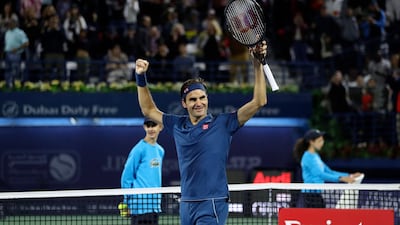 Roger Federer celebrates after winning the Dubai Duty Free Tennis Championships title for an eighth time. AFP