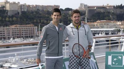 Novak Djokovic, left, and Stan Wawrinka, pose for photos at the Monaco yacht club ahead of the Monte Carlo Masters. Lionel Cironneau / AP Photo