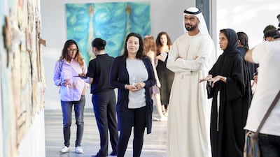 Angela Migally, Executive Director & General Counsel of the Salama bint Hamdan Al Nahyan Foundation; HE Saif Saeed Ghobash, Director General of the Department of Tourism and Culture and Khulood al Atiyat, Manager of Arts, Culture and Heritage at the Salama bint Hamdan Al Nahyan Foundation at the opening of Community & Critique: SEAF Cohort 4 at Warehouse421.