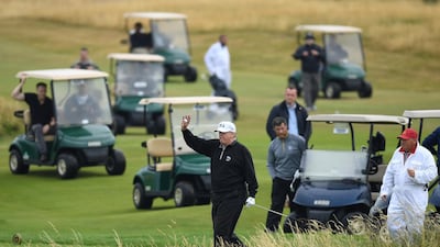 Then US President Donald Trump waves whilst playing a round of golf at Trump Turnberry Luxury Collection Resort during his first official visit to the United Kingdom as President in 2018. Getty Images