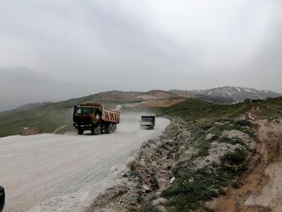 Lorries travel along the road leading to stone quarries near the village of Ain Dara in Lebanon's Chouf area. Sunniva Rose / The National