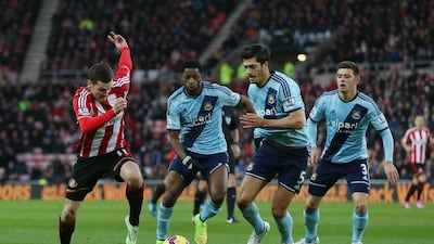 Adam Johnson of Sunderland runs at the West Ham United defence during their 1-1 draw in the Premier League on Saturday at the Stadium of Light. Chris Brunskill / Getty Images