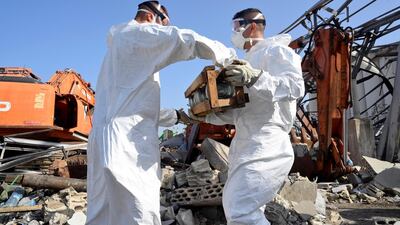French UN peacekeepers work and clean-up the port of Beirut on September 30. EPA