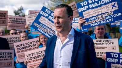 Scottish Conservative leader Russell Findlay on the campaign trail in Juniper Green, Edinburgh. PA