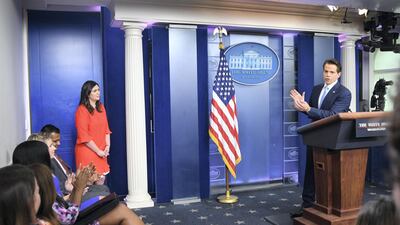 Anthony Scaramucci speaks as nWhite House press secretary Sarah Huckabee Sanders looks on during a press briefing at the White House in Washington, DC, July 21, 2017. AFP