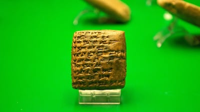 A cuneiform clay tablet at Basra Museum. Cuneiform, like Egyptian hieroglyphics, offers scholars lessons about life and civilisations from thousands of years ago. AFP