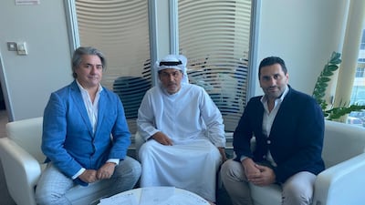 Nasser Al Tamimi, board member of the Racing City Group, is flanked by film producer Paolo Odierna, left, and Morris Pagniello, founder of Genova International Soccer Academy. Courtesy Racing City Group