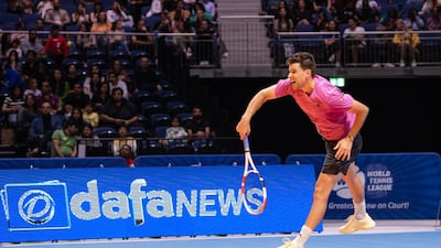 Dominic Thiem, of team Hawks, serves against Felix Auger-Aliassime, of the Kites, during their match at the World Tennis League at Coca-Cola Arena, in Dubai on Thursday, December 22, 2022. Photo: World Tennis League