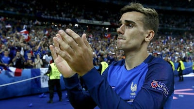 Antoine Griezmann applauds the French fans at the Stade de France following the 1-0 defeat to Portugal in extra time of Sunday's Euro 2016 final in Paris. Etienne Laurent / EPA