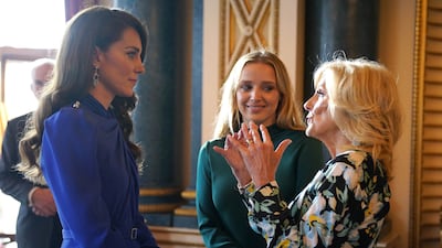 The Princess of Wales talks with US first lady Jill Biden and her granddaughter Finnegan Biden during the reception. Reuters