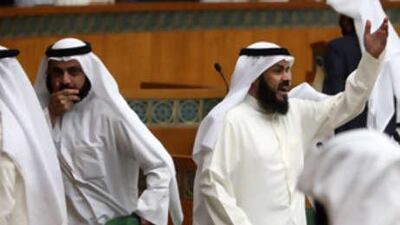 The Kuwaiti MPs Walid al Tabtabai, left, and Abdullah al Barghash, right, attends a parliament session at the national assembly in Kuwait City on Nov 25 2008.