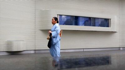 A woman wearing a kimono walks at Tokyo's Ginza shopping district. Yuya Shino / Reuters