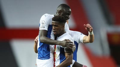 Palace's Wilfried Zaha celebrates with Cheikhou Kouyate after scoring their third. Reuters