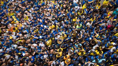 Fans of Boca Juniors wait to enter the Maracana, in Rio de Janeiro, where their side played against Brazilian team Fluminense in the Copa Libertadores final. AFP