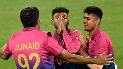 Karthik Meiyappan celebrates his hat-trick with teammates Junaid Siddique and Aryan Lakra in Geelong. AFP